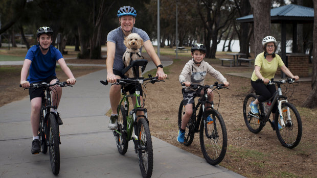 Darren, along with his sons Toby (left), Cameron, wife Sarah and dog Archie are participating in the Spring Financial Group Spring Cycle.