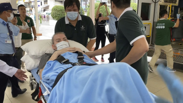 A British pilot, identified by the official Vietnam News Agency as Stephen Cameron, is carried on a stretcher from a hospital in Ho Chi Minh city, Vietnam. He was the most critical COVID-19 case in the country but has recovered and been released from hospital.