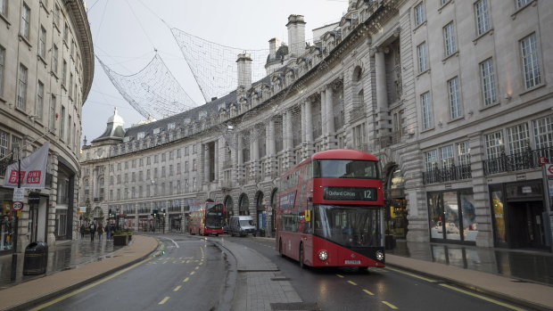 Buses on an empty Regent Street in London.