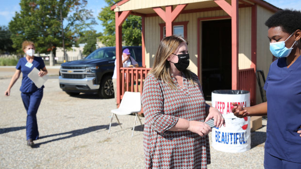 Dr Martha Whyte organises healthcare workers during a drive-through flu shot clinic at the Louisiana State Fairgrounds in Shreveport, Louisiana.