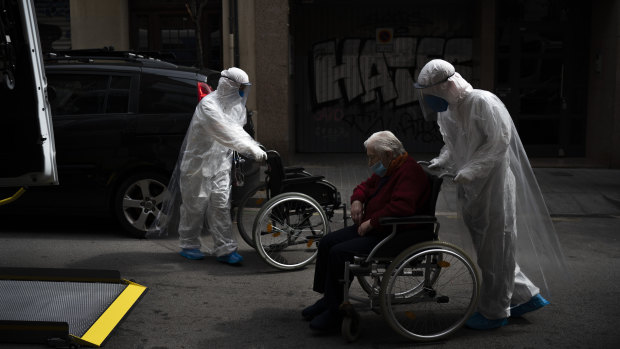 A nursing home resident displaying coronavirus symptoms is taken to hospital in Barcelona.
