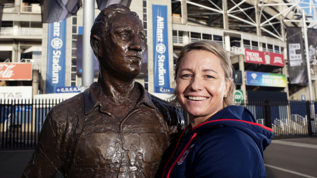 Pioneer: Kylie Hilder poses with a statue of Dally Messenger outside Allianz Stadium on the eve of the opening weekend of the NRLW.