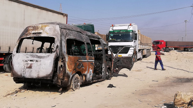 The destroyed minibus near an Iraqi army checkpoint south of Karbala, Iraq.