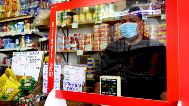 A milk bar owner stands behind his counter in Otara, Auckland, during level-three lockdown.
