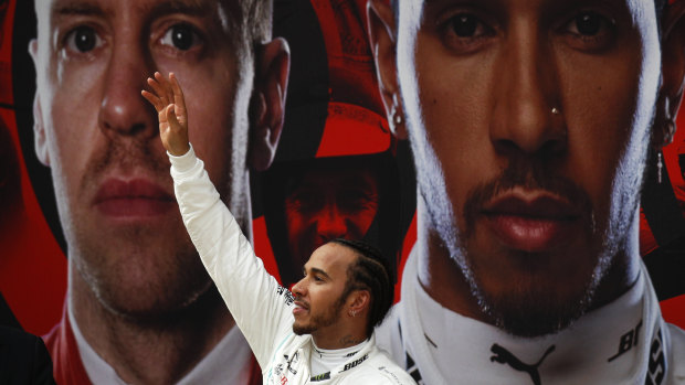 Mercedes driver Lewis Hamilton waves to his fans after winning the Chinese Formula One Grand Prix at the Shanghai International Circuit on Sunday.