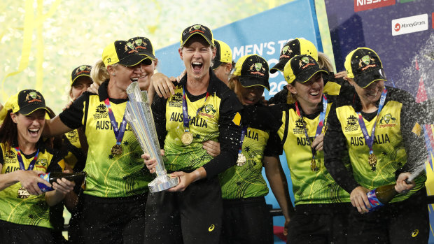The Australian team celebrate their win over India on Sunday night.