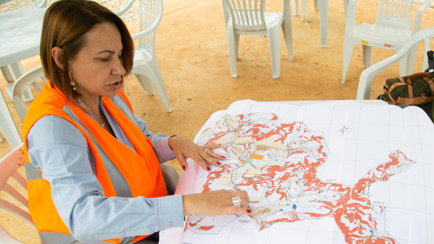 Renova Resettlement Manager Patricia Lois, left, at the site of the new Bento.