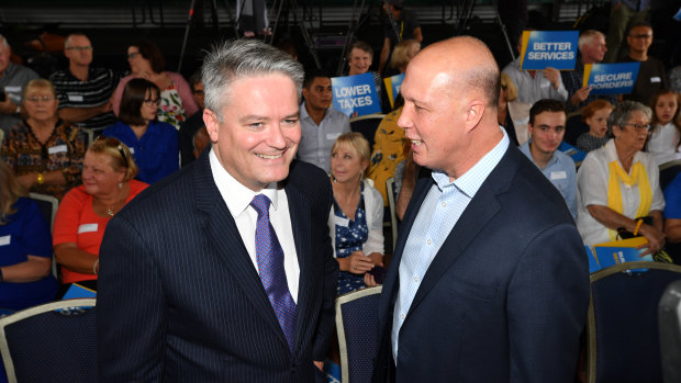 WA Liberal senator and Finance Minister Mathias Cormann with Home Affairs Minister Peter Dutton in Queensland on Sunday.
