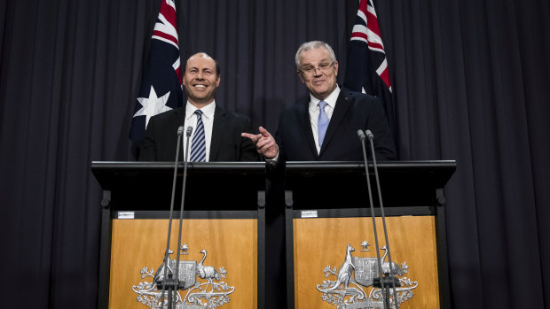 Josh Frydenberg and Scott Morrison address the media on Friday.