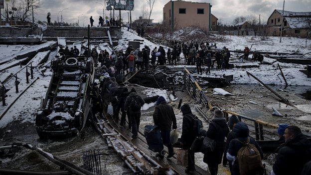 People flee Kyiv on March 8.