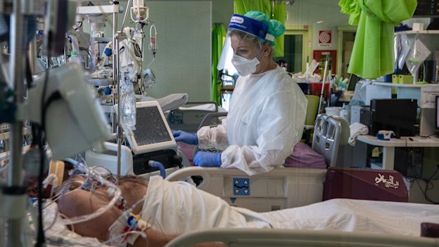 Dr Annalisa Malara next to a patient in the COVID-19 intensive care unit of the Ospedale Maggiore di Lodi.