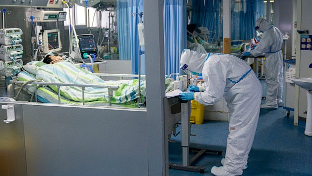 A medical worker attends to a patient in the intensive care unit at Zhongnan Hospital of Wuhan University in central China's Hubei Province. 