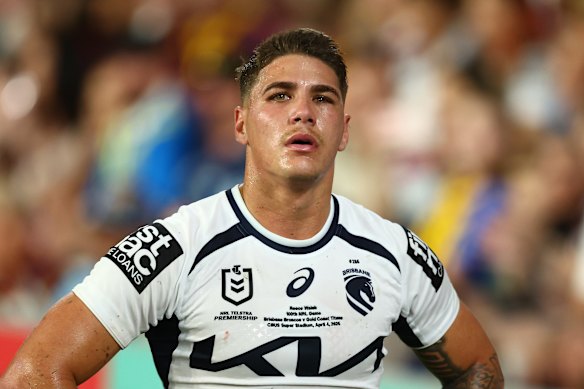 Walsh walks off the field after his injury.