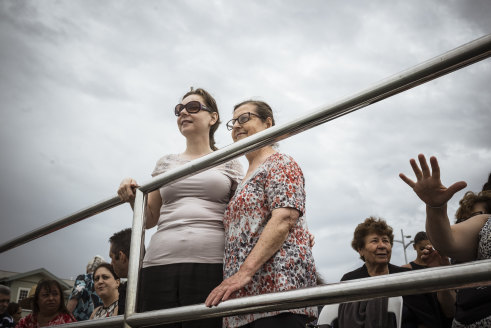 Zaharoula Mouzakis, with her mother Alexandra, watched the Blessing of the waters swim from Princes Pier.