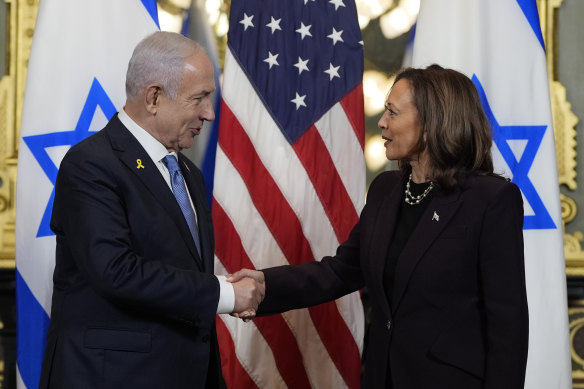 Vice President Kamala Harris, right, shakes hands with Israeli Prime Minister Benjamin Netanyahu before a meeting at the Eisenhower Executive Office Building on the White House complex in Washington.