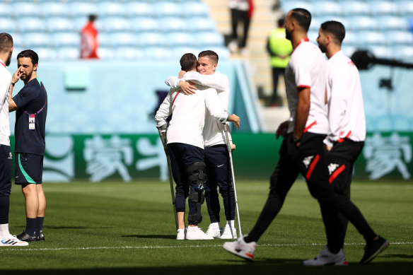 Martin Boyle embraces Cameron Devlin prior to the Socceroos’ Group D clash with Tunisia.