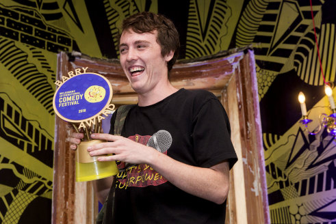 Sam Campbell in 2018, accepting his Barry Award for the most outstanding comedy act at the Melbourne International Comedy Festival.