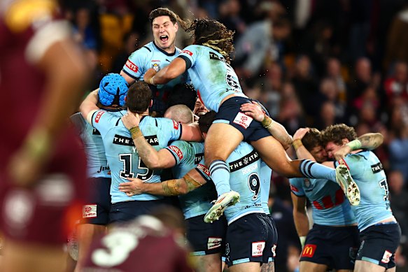 Mitchell Moses and the Blues celebrate a remarkable series-deciding win in Brisbane in 2024.