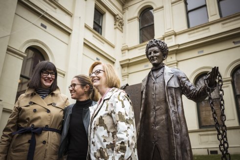Former prime minister Julia Gillard with Kristine Ziwica (left) and Professor Clare Wright from A Monument of One’s Own, in front of Jennifer Mann’s statue of activist Zelda D’Aprano.