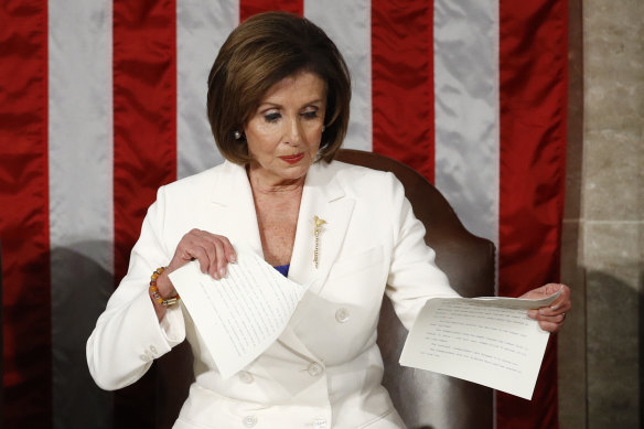 Nancy Pelosi tears up her copy of Donald Trump's State of the Union speech.