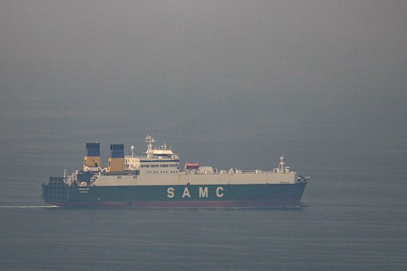 A cargo ship sails in the Arabian Gulf towards the Strait of Hormuz on Sunday.