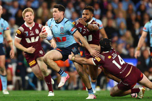 Mitchell Moses makes the break to seal the match and the series for NSW.