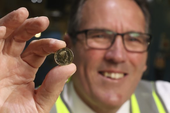The Queen has featured on all Australian coins in the decimal currency age, including this $2 coin 
 held by Royal Australian Mint CEO Leigh Gordon in 2021.
