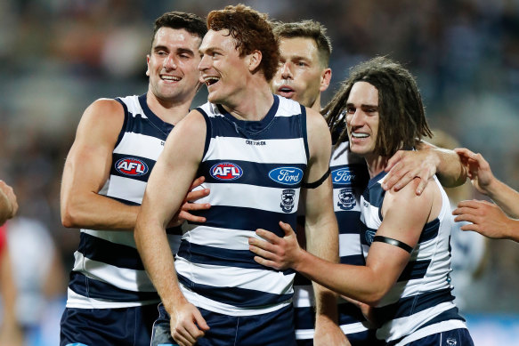 Mark O’Connor, Gary Rohan, Shaun Higgins and Gryan Miers of the Cats celebrate.