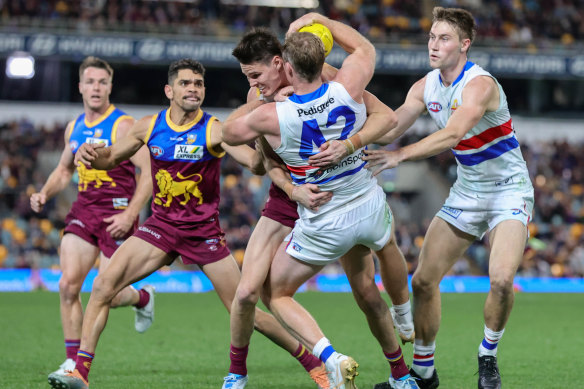 Bulldog Alex Keath is tackled during the loss to the Lions.