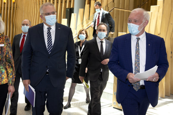 Patrick McGorry (R), pictured with Prime Minister Scott Morrison, thinks lockdowns are ‘really starting to get to people’.