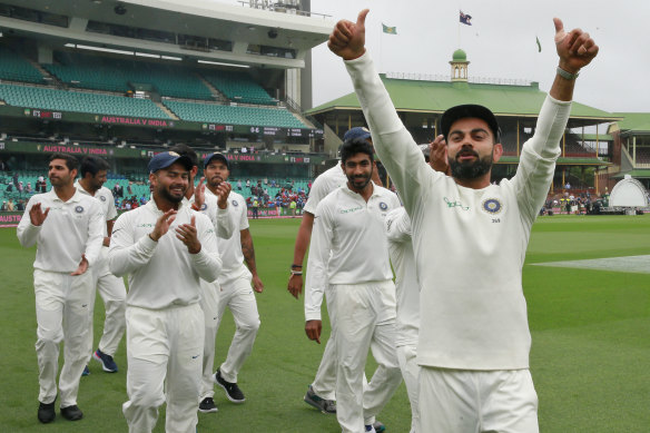 Virat Kohli's Indian team celebrates their series win against Australia last summer.