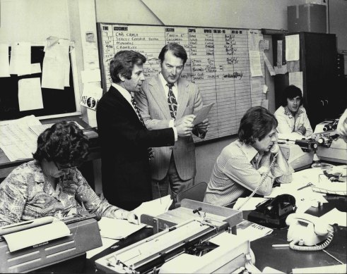 Bob Johnson (left) and Roger Climpson in the Channel 7 newsroom before the show goes on air.