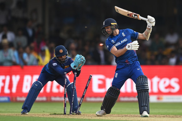 England’s Mark Wood is stumped by Kusal Mendis. 