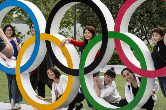 People have their photographs taken in Tokyo.