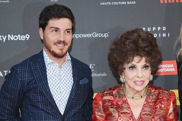 Gina Lollobrigida, right, claims her 33-year-old assistant Andrea Piazzolla, pictured with her in 2018, sold art and antiques without her permission. 