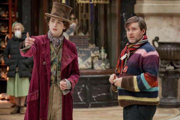 Timothee Chalamet and director Paul King on the set of Wonka.