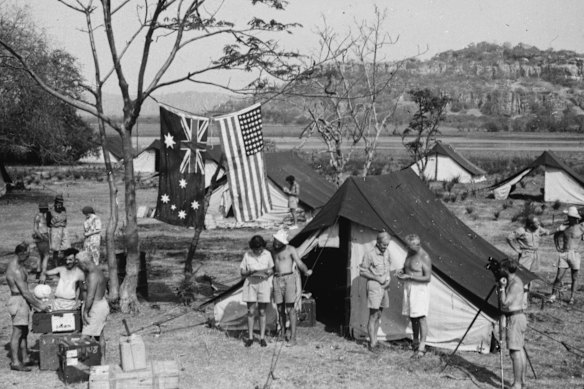 A staged photograph of the expedition camp at Gunbalanya. In the background is Injalak, the plateau where Howell Walker filmed Frank Setzler stealing human bones from traditional mortuary sites.