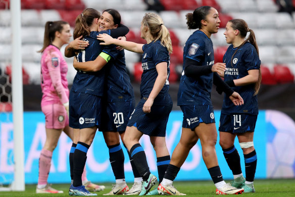 Sam Kerr is mobbed by teammates moments after nailing Chelsea’s third goal against Bristol City.
