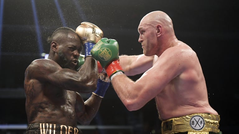 Tyson Fury and Deontay Wilder battle it out.