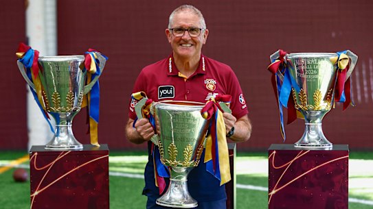 Retiring coach Chris Fagan with his three Lions premiership cups.