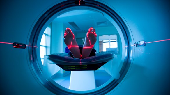 Feet-first through the doughnut.