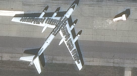 A satellite image from Maxar Technologies shows car tyres placed on top of two Tu-95 bombers at Engels airbase near Saratov, Russia.