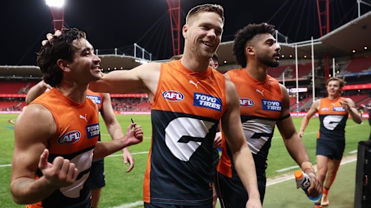 Toby Bedford and Harry Himmelberg celebrate the Giants’ win over Fremantle.