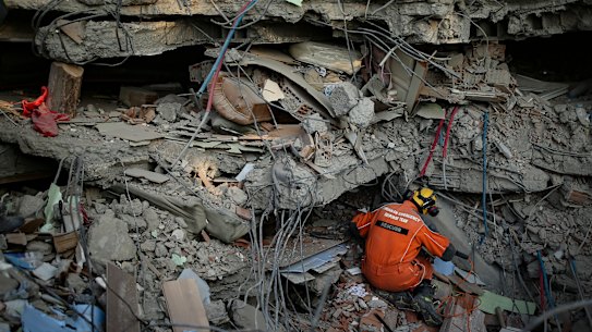 A Turkish rescue worker checks a collapsed building in Adiyaman, southern Turkey on Saturday, February 11, 2023.