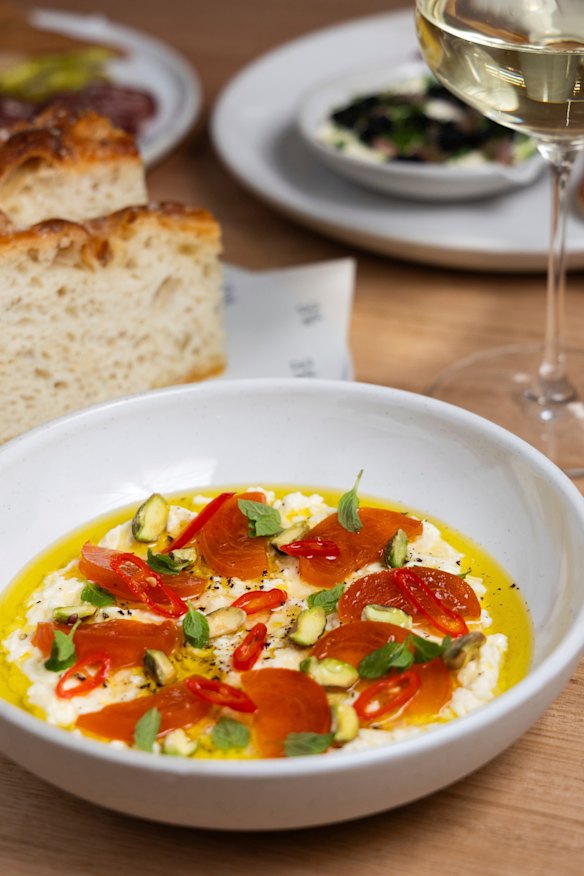 Stracciatella with pickled chilli, mint, persimmon and pistachio