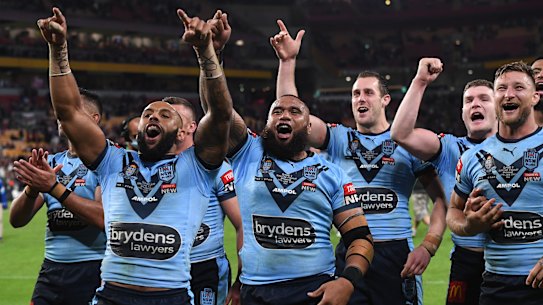 A jubilant NSW side celebrate at Suncorp Stadium.