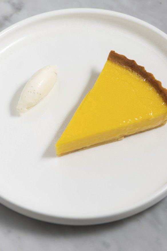 The lemon tart hovers between liquid and solid.