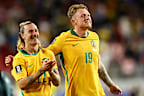 Jackson Irvine #22 and Harry Souttar #19 of Australia celebrate after a 0-0 draw.
