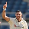 Australia’s Scott Boland celebrates after taking the wicket of West Indies’ Jomel Warrican to complete a hat-trick. 