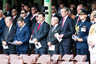 Former prime minister John Howard and NSW Premier Dominic Perrottet at a state funeral for rugby league player John Raper at the SCG in February.